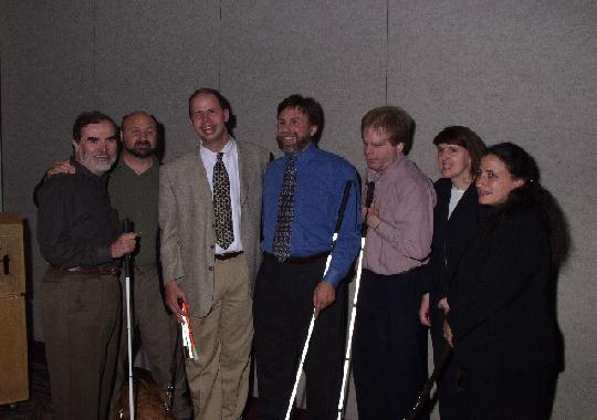 A group from the American Foundation for the Blind, including Carl Augusto,
Jim Denham from ACB, Paul Schroeder, Jay Leventhal, and Lynn Zelvin from ACB,
take a break from the Careers and Technology Information Bank meeting to pose
for the camera.