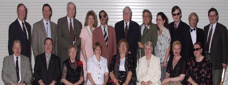 Former and current board members pose for a few shots.
Top row, left to
right: Alan Beatty, Ed Doc Bradley, Oral Miller, Ardis Bazyn, Mitch
Pomerantz, LeRoy Saunders, Paul Edwards, Dawn Christensen, Brian Charlson,
Chris Gray and Steve Speicher.  Bottom row, left to right: Sandy Sanderson,
Sanford Alexander, Donna Seliger, Debbie Grubb, MJ Schmitt, Pat Beattie,
Cynthia Towers and Kim Charlson.