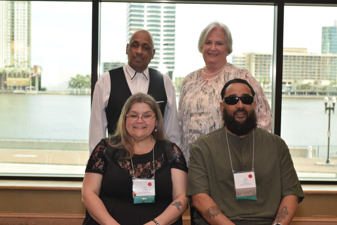 Back Row: Kenneth Semien, Chair and Zelda Gebhard, Vice Chair  Front Row: 2024 DKM First Timers Cassie Trosper and Jason Miller