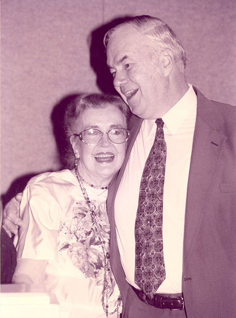 Oral Miller laughs in surprise as he hugs his cousin, Virginia Fouts, who was flown in especially for Oral’s retirement celebration. 