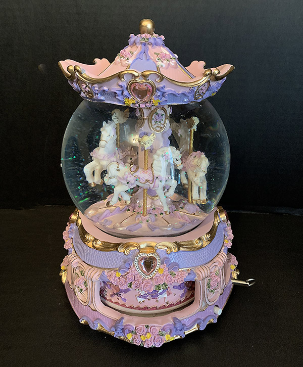 Snow Globe with Merry-go-round Carousel design in pink and lavender colors