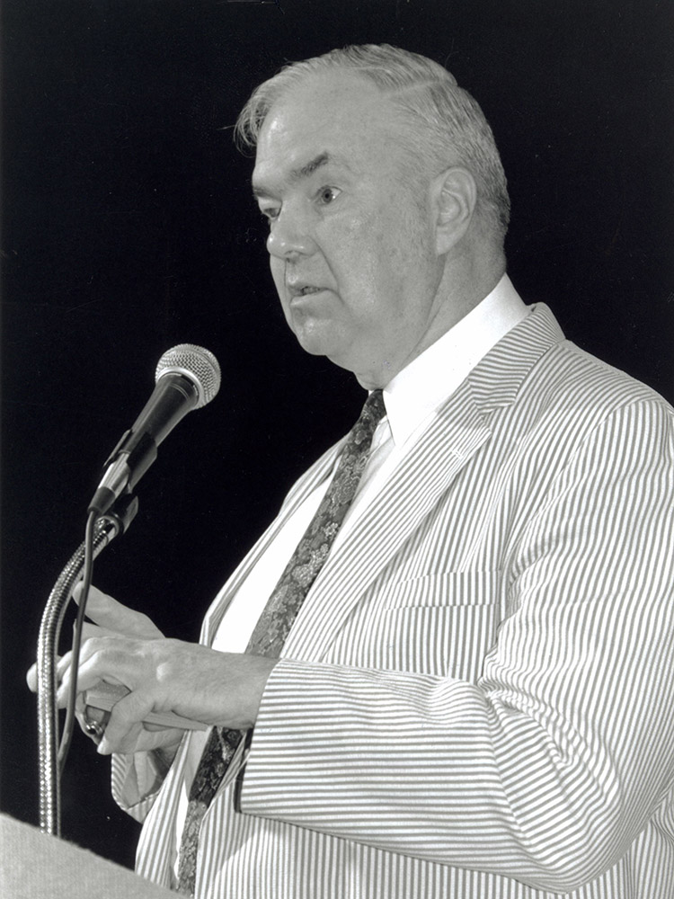 Oral Miller examines a small gift box at the 1998 “Miller Time” convention banquet.