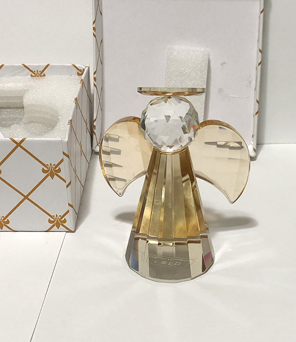 Crystal Angel next to opened box